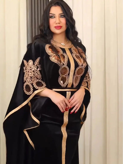 Luxurious Moroccan Dubai dress, crafted from plush golden velvet, showcasing an exquisite design with short bat sleeves for graceful movement during festive occasions.