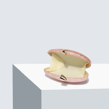 Trendy Ellipse Clutch Purse with elegant chain design, perfect accessory for sophisticated evening events.