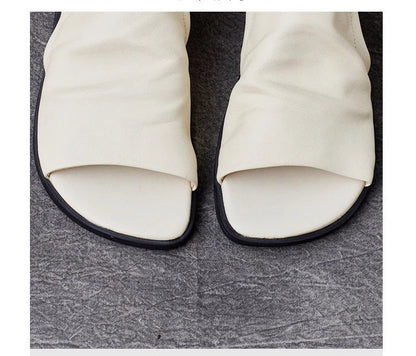 Luxury flat sandals for women, crafted from genuine leather with hook and loop closure, ideal for comfort and style.