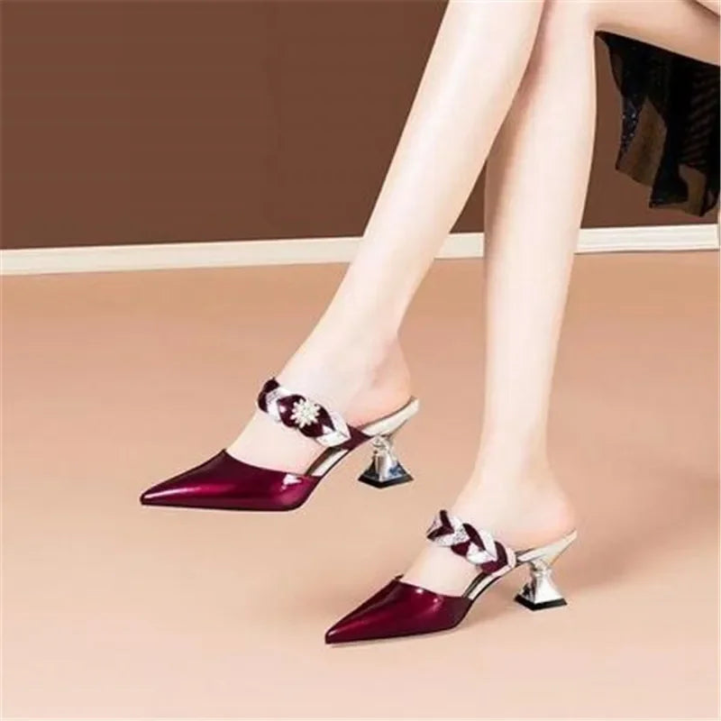 Close-up view of high heel women's slippers featuring a comfortable slip-on design and shimmering pearls, ideal for party wear.