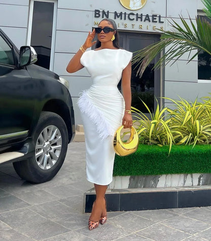 Chic women's ankle length office dress in a solid shade, showcasing a stylish O neck and a flattering slim fit, complemented by exquisite feather embellishments, ideal for professional settings.