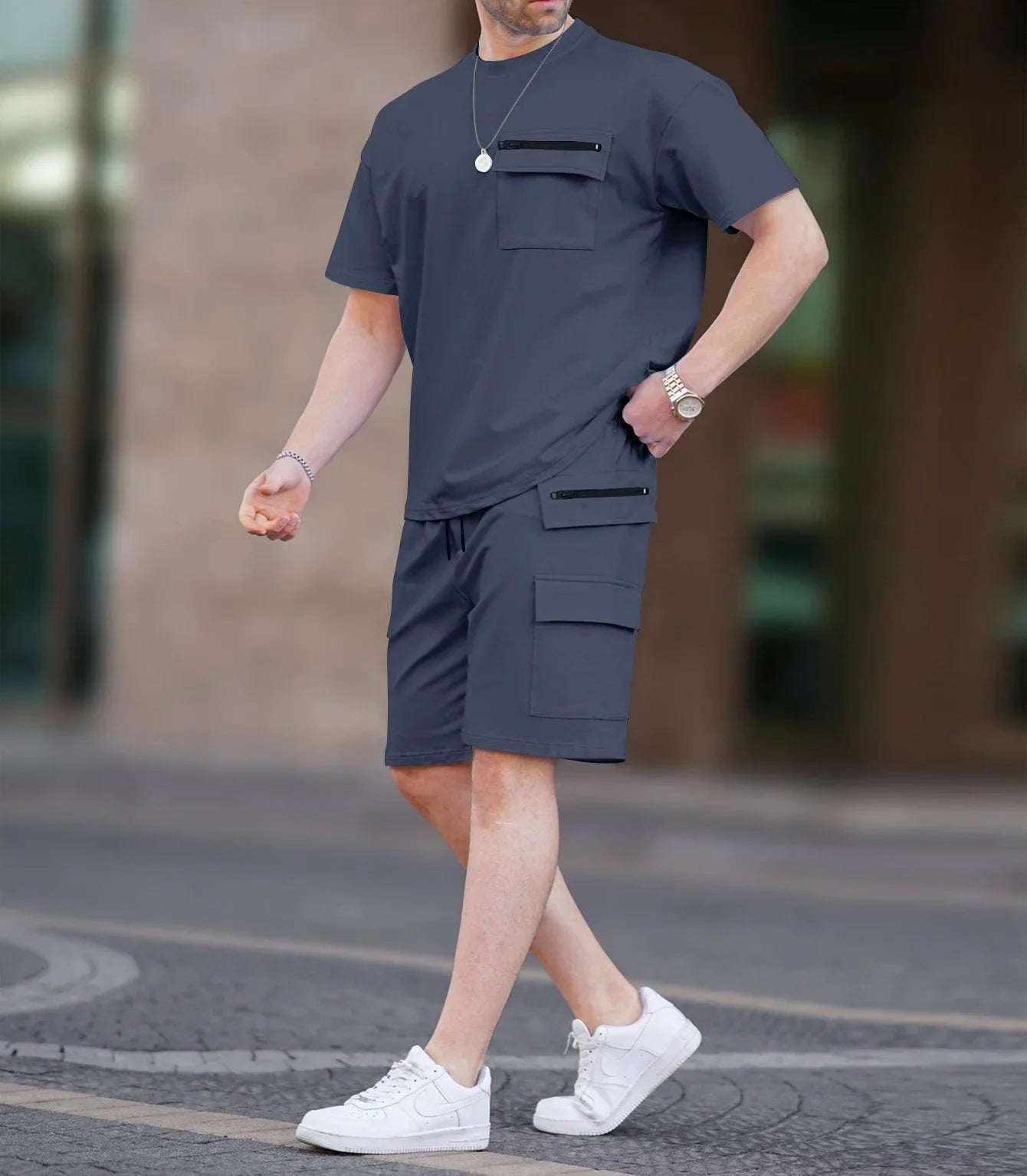 Elegant summer shorts designed for men, showcasing a casual drawstring closure and made from a lightweight blend of polyester and cotton, perfectly paired with the matching utility t-shirt.