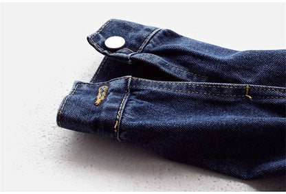 Graceful silhouette of a luxury women's denim jacket worn in a summer setting, highlighting contemporary fashion trends.