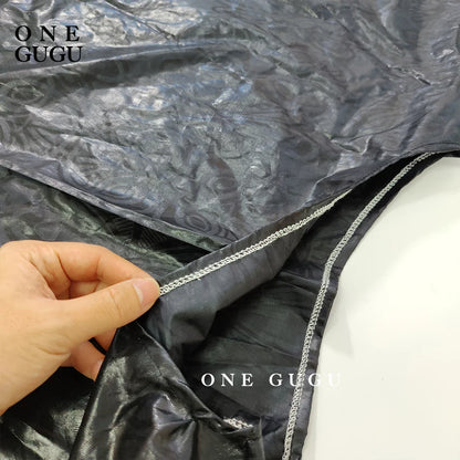 Close-up detail of luxurious embroidery on the African Bazin dress robe, illustrating fine craftsmanship and ethnic style.