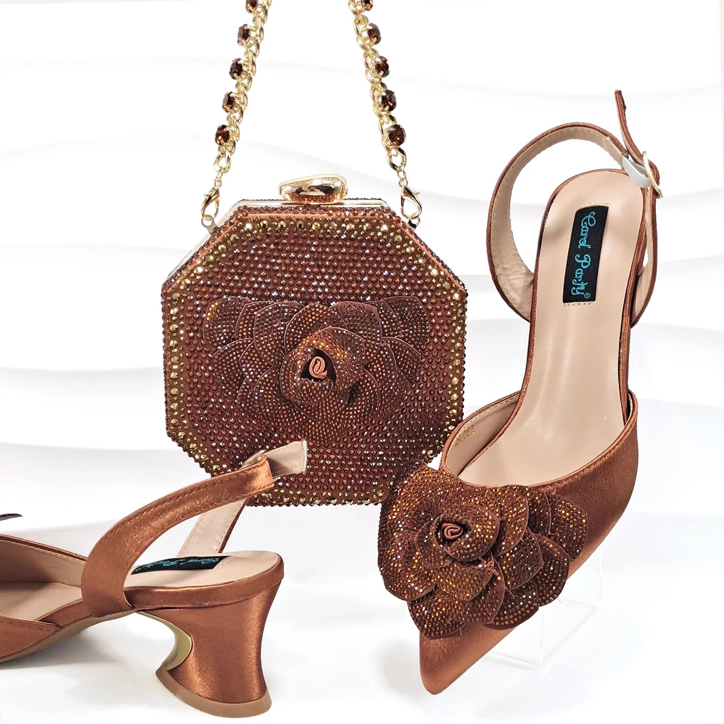 Close-up of QSGFC Women's Wine pumps showcasing crystal embellishments and ankle strap, combining style and luxury.