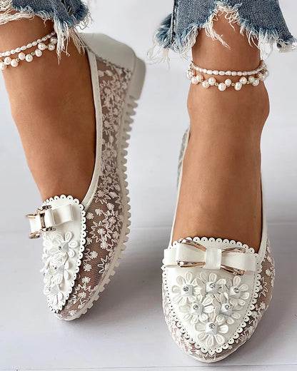 Elegant women's summer sneakers showcasing a refined bowknot and breathable upper material, perfect for upscale casual outings.