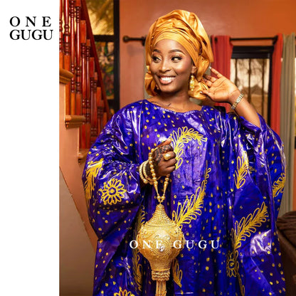 Luxurious blue Dashiki gown showcasing exquisite embroidery lace and a matching shawl, ideal for parties and weddings.