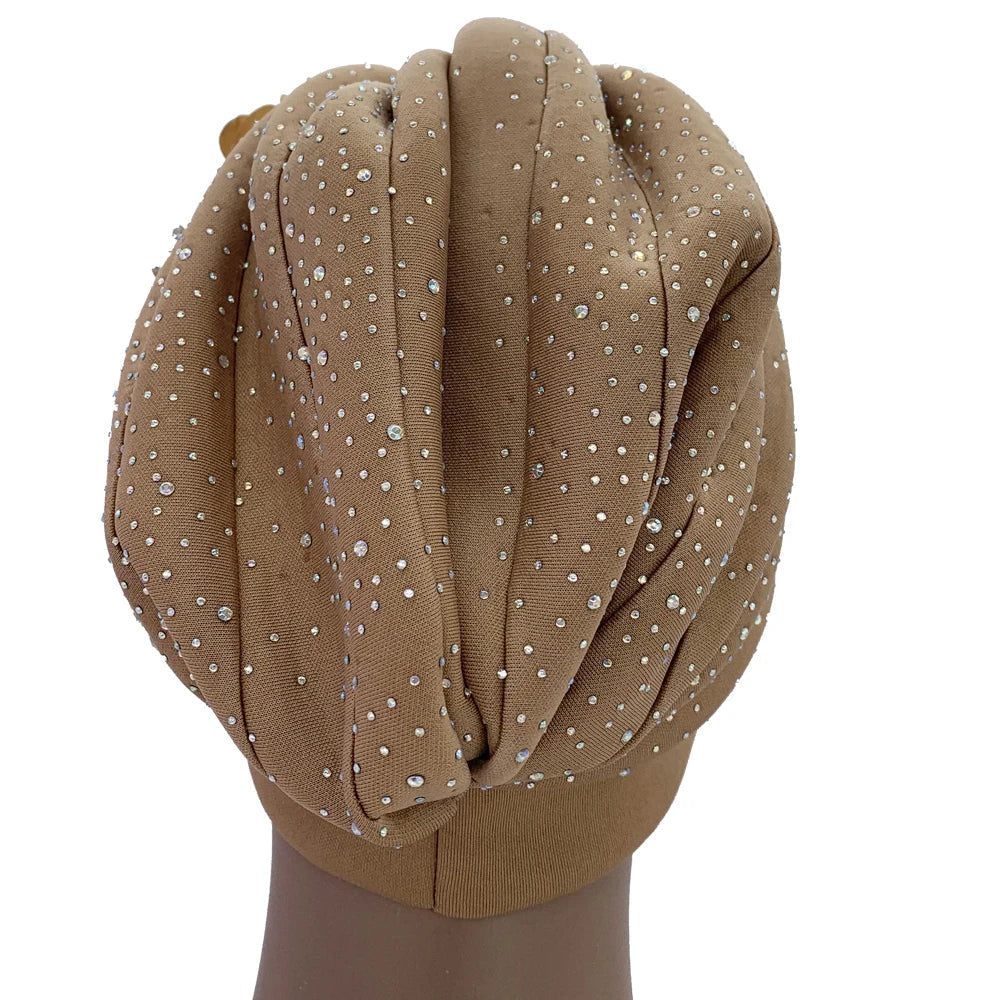 Stylish head wrap for women, the African turban cap in rich fabric texture with a focus on its beautiful fit and draping.