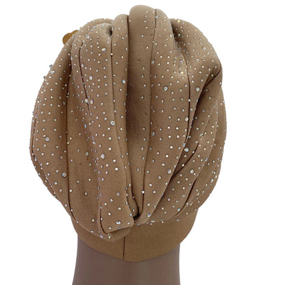 Stylish head wrap for women, the African turban cap in rich fabric texture with a focus on its beautiful fit and draping.