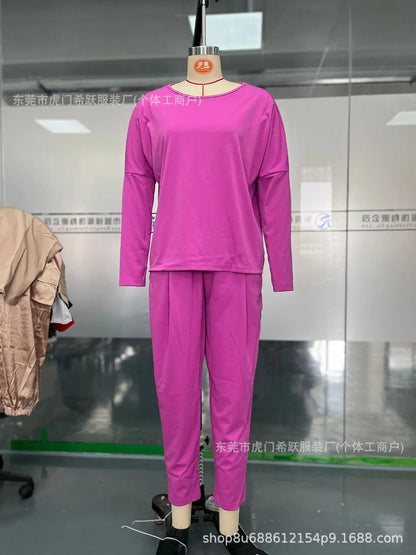 Chic women's two piece set displayed on a model, highlighting the flattering regular fit and elegant silhouette of the full sleeve top and ankle-length pants.