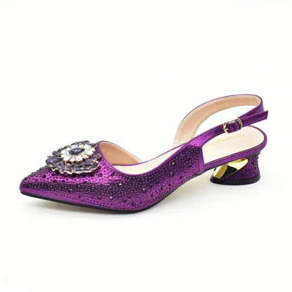 Display of Italian women's rhinestone heels and matching bag set in vibrant gold, exemplifying elegance and style for party occasions.