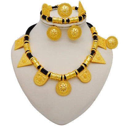 Exquisite bridal jewelry set in gold colour showcasing intricate African designs, including a necklace, earrings, bracelet, and ring perfect for elegant occasions.