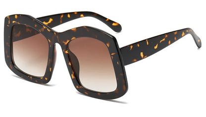 Elegant women's oversized square sunglasses with a stunning orange gradient design, offering optimal UV400 protection for enhanced eye safety.