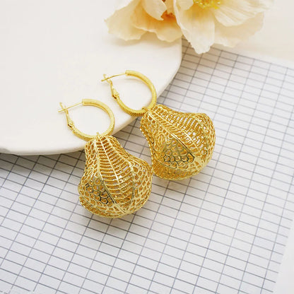 Luxurious geometric drop earrings embellished with long tassels, perfect for elevating any wedding attire effortlessly.