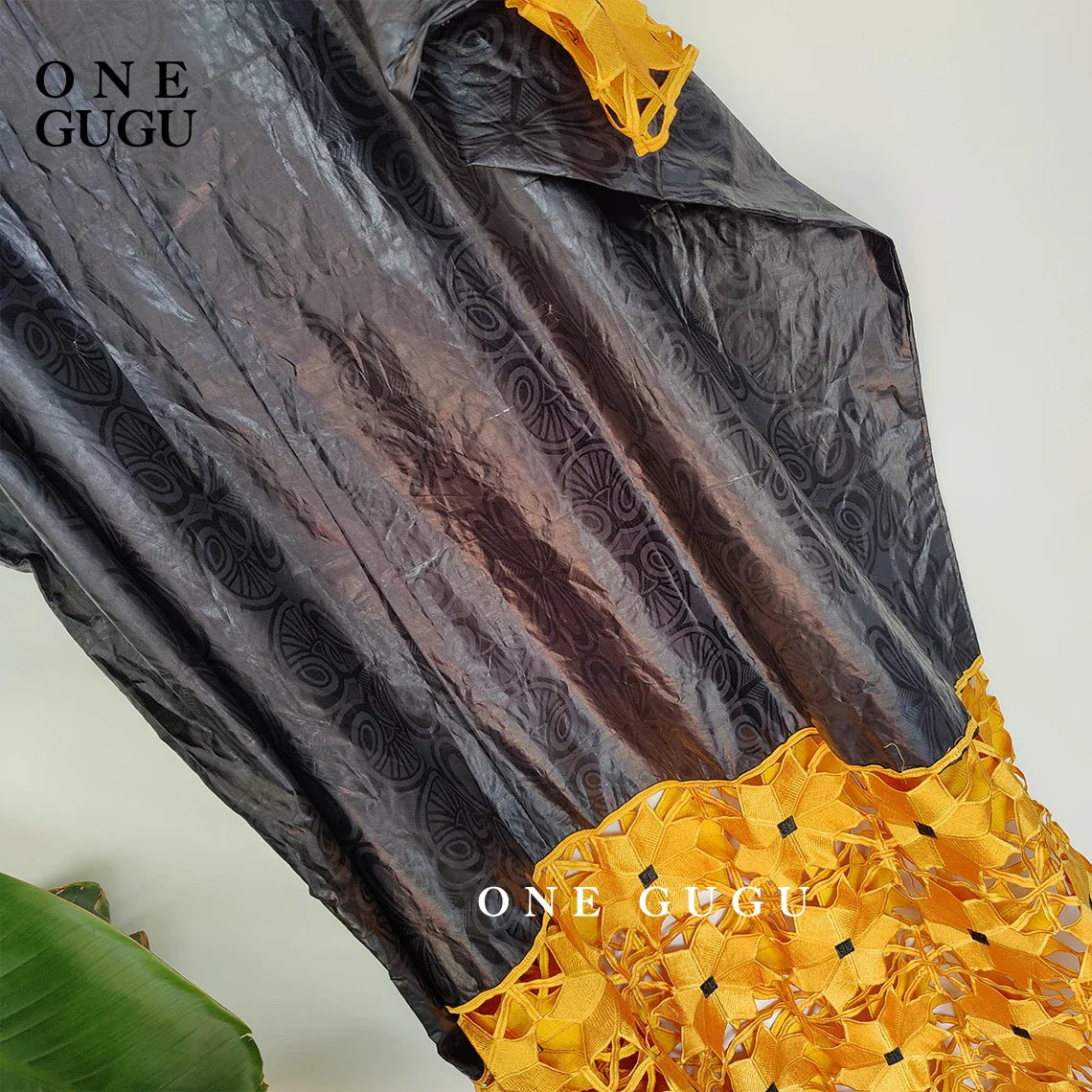 Stylishly displayed luxury Dashiki gown in a vibrant gold and white colour scheme, perfect for parties, weddings, or daily wear.