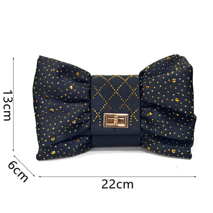 Close-up of luxurious wine colour women's heeled shoes highlighting the intricate rhinestone embellishments and fashionable butterfly-knot design.