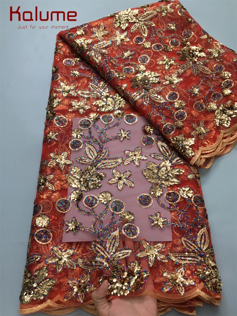 Close-up view of high-quality Kalume mesh lace adorned with sparkling rhinestones for luxurious garment creation.