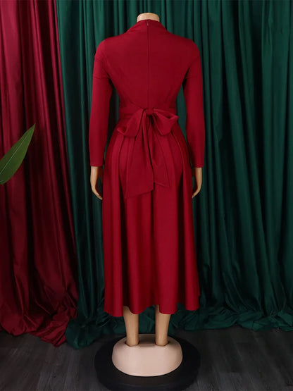 Model wearing the Wmstar Plus Size Women's Long Dashiki Dress at a chic party, exuding elegance and style for plus size women.