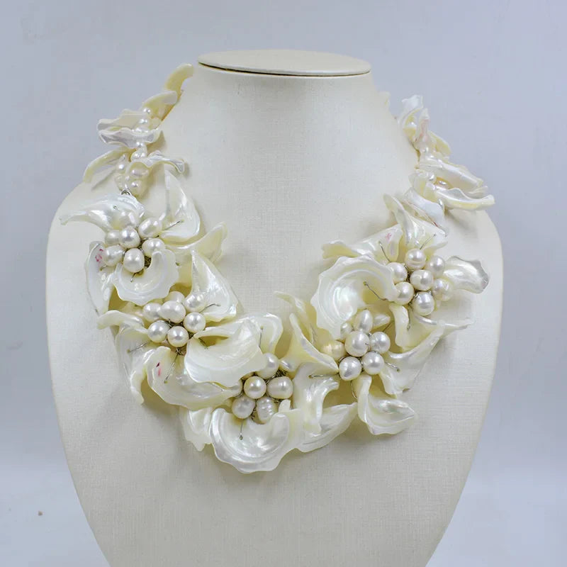 Stylish shell flowers jewelry set including earrings and necklace, a perfect addition to any bridal wardrobe.