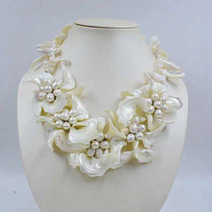 Stylish shell flowers jewelry set including earrings and necklace, a perfect addition to any bridal wardrobe.