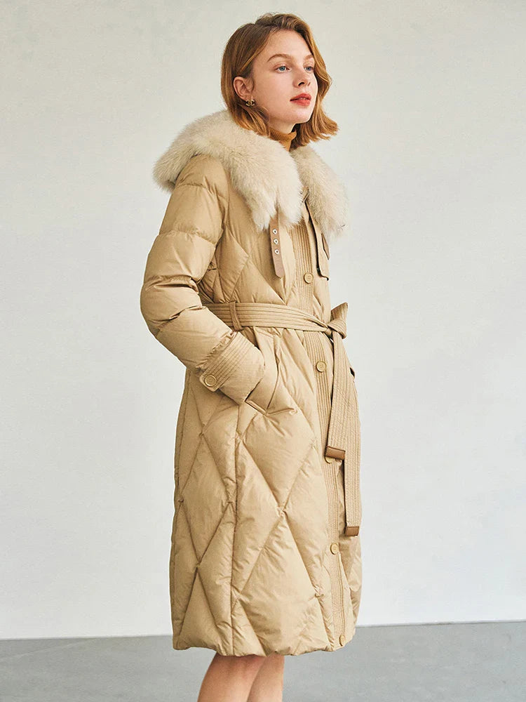 Sophisticated women's winter coat displayed on a stylish model, epitomizing comfort with its long length and exquisite detachable fur collar.