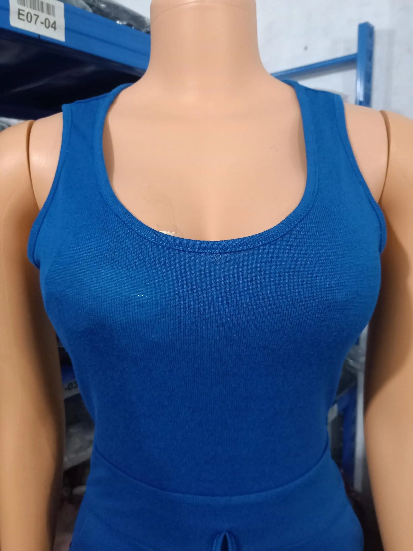 Chic two-piece women's jumpsuit set featuring a sleeveless design complemented with a luxurious long sleeve coat, showcasing a high waist and sophisticated drawstring pockets.