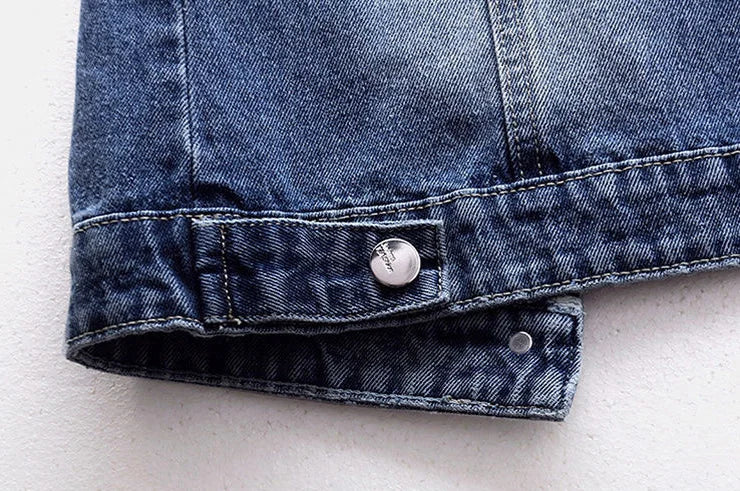 Luxury pearl-embellished denim vest for women showcasing elegant stitching and a distressed finish, perfect for casual autumn wear.