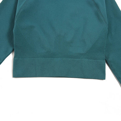 Chic WAREBALL Seamless Yoga Set displayed in soft pink, showcasing the perfect blend of comfort and style for upscale women’s fitness apparel.