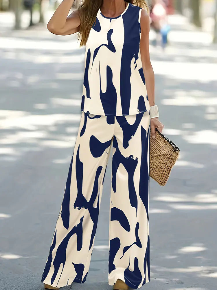 Elegant women's sleeveless chiffon top paired with long wide-leg pants, perfect for luxurious summer outings.