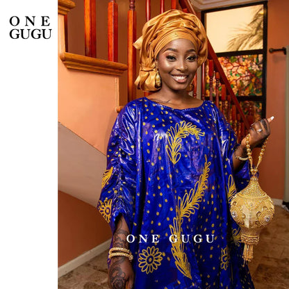Elegant Premium Nigerian Bazin Riche Dashiki gown in blue with intricate embroidery lace detail, perfect for special occasions.