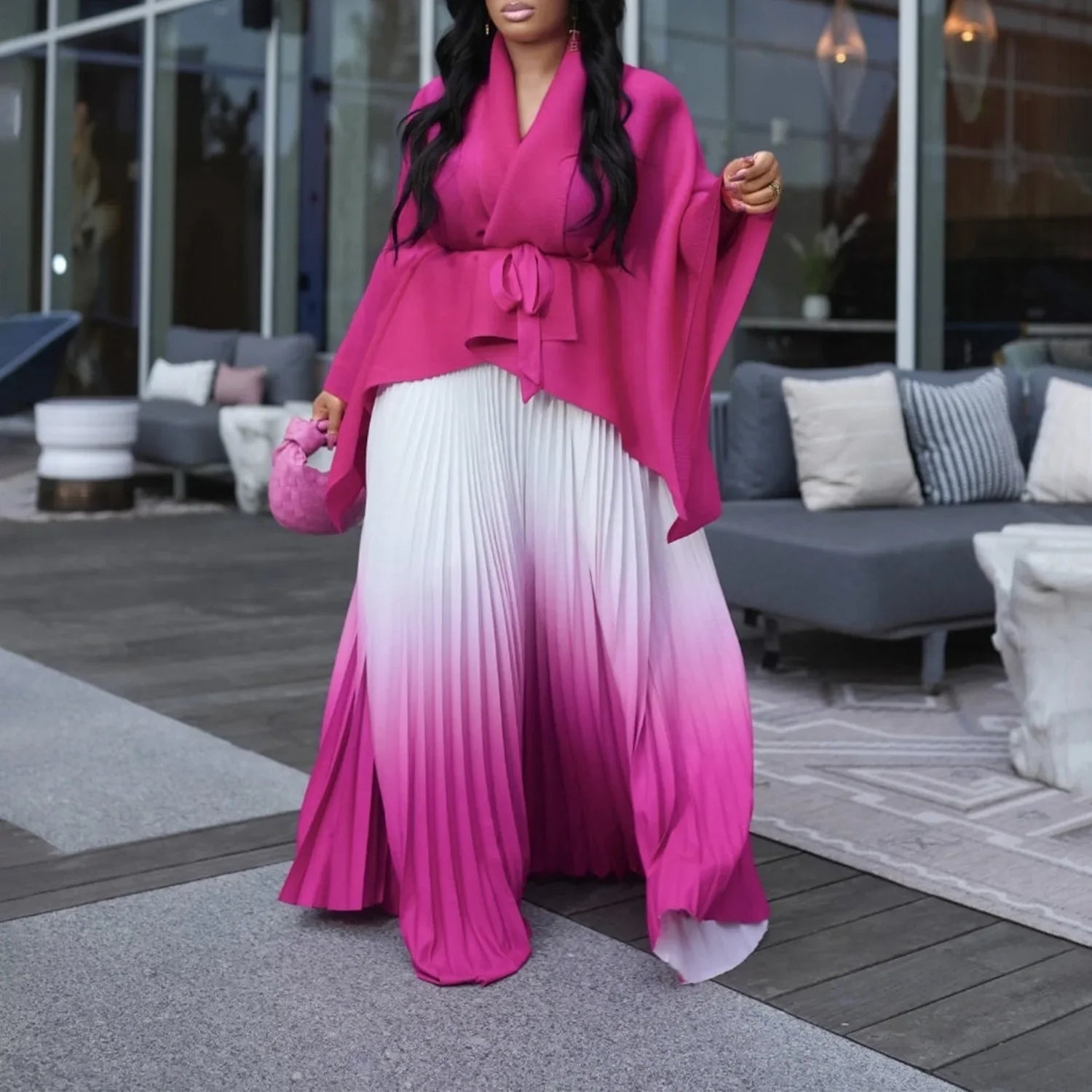 Luxurious autumn/winter ensemble by CM.YAYA, combining comfort and chic with its knitted fabric and elegant sashes.