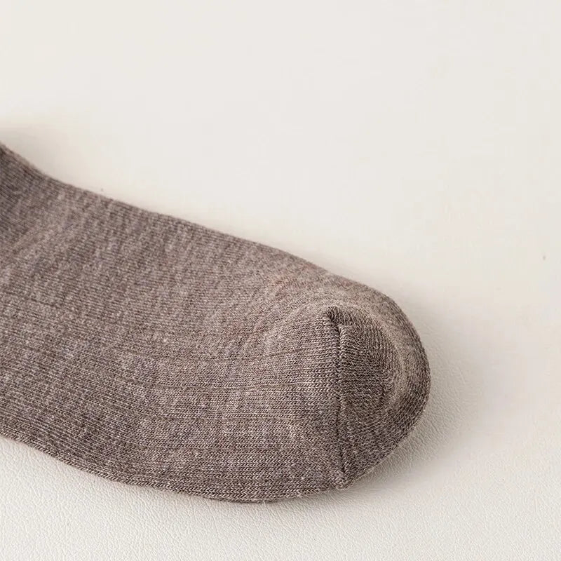 Premium quality winter socks for men, featuring a blend of polyester and spandex for superior elasticity.