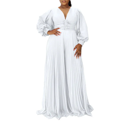 Chic Plus Size Women’s Autumn Dashiki Jumpsuit showcasing intricate fabric patterns, designed for elegance with a long sleeve V-neck silhouette in a striking blend of colours including black and rose red.