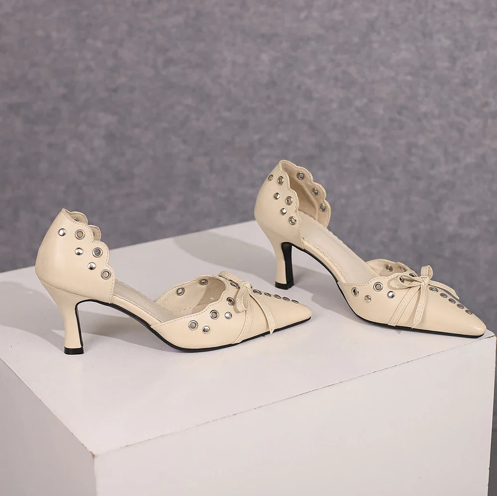 Luxury women's high heel sandals featuring a chic bow design and rivets, perfect for summer dress occasions.