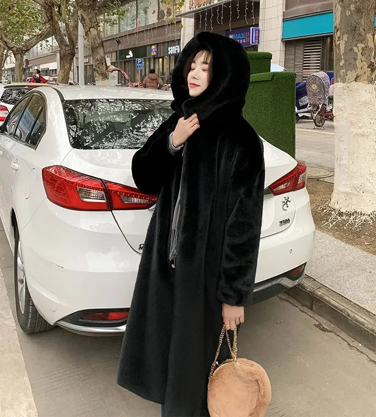 Luxury women's faux fur maxi coat in elegant black, featuring a chic V-neck design, perfect for autumn and winter.