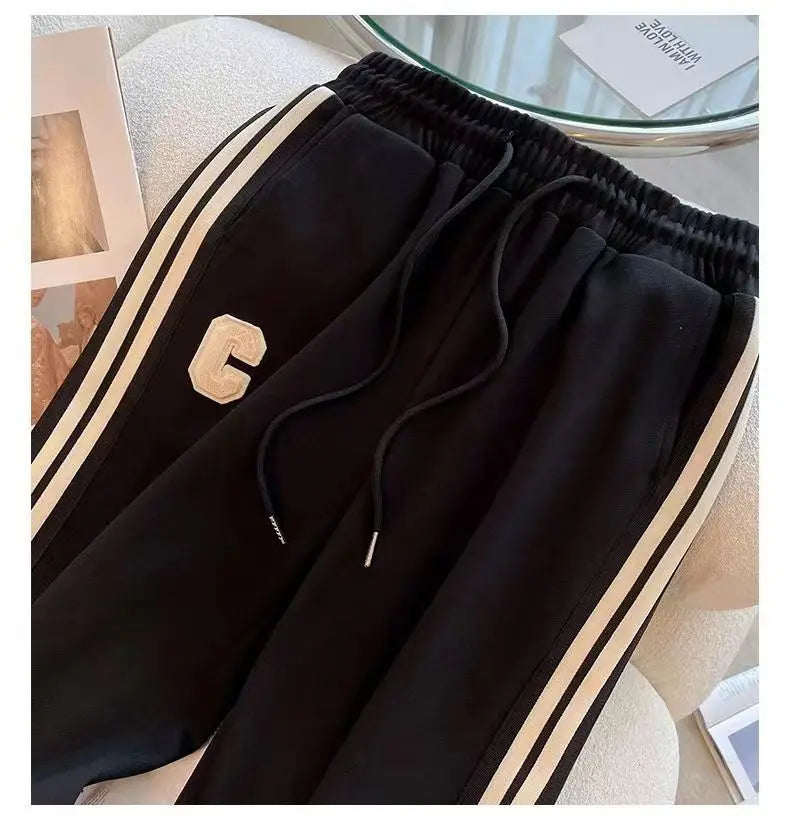 Close-up of the stylish embroidered coat from the autumn winter women's sports set, showcasing intricate design details.