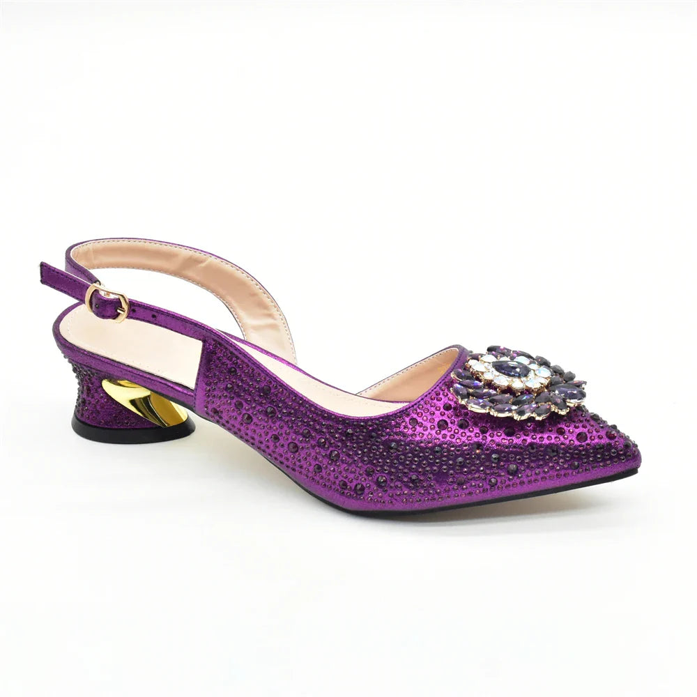 Stunning green rhinestone heel pumps alongside a beautifully matched handbag, offering an elegant statement for special occasions.