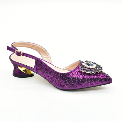 Stunning green rhinestone heel pumps alongside a beautifully matched handbag, offering an elegant statement for special occasions.