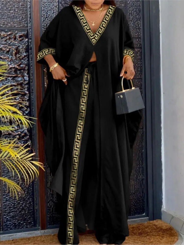 Women's luxury V-Neck loose long sleeve top featuring stylish letter print in a casual fashion ensemble with wide leg pants.