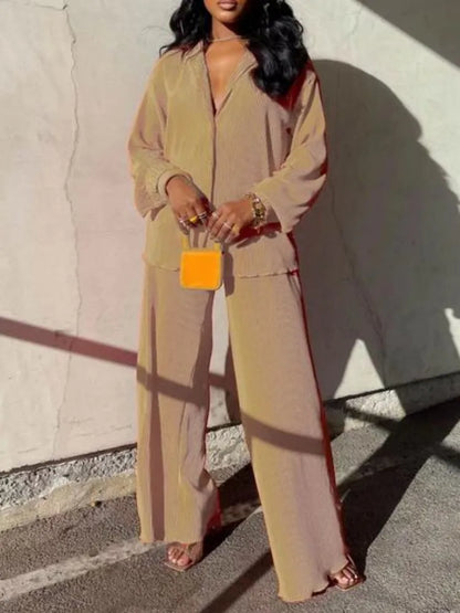 Elegant women's oversized long sleeve pleated shirt in S-XXL, paired with high waist wide leg pants, ideal for autumn and winter fashion.