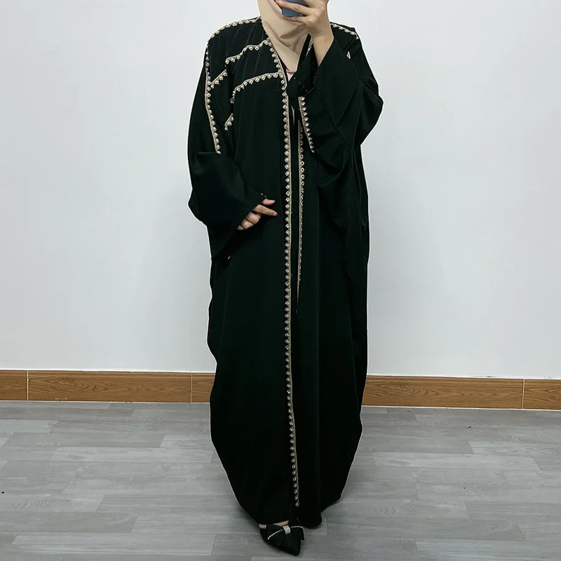 Elegant bat sleeve design of the Ramadan luxury abaya, made from plush golden velvet, ideal for stylish and modest evening wear.