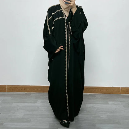 Elegant bat sleeve design of the Ramadan luxury abaya, made from plush golden velvet, ideal for stylish and modest evening wear.