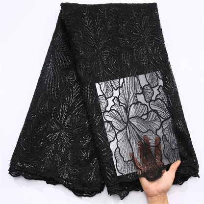 Elegant display of Nigerian wedding dress fabric made of soft polyester and nylon blend, exhibiting a rich texture complemented by sophisticated sequins.