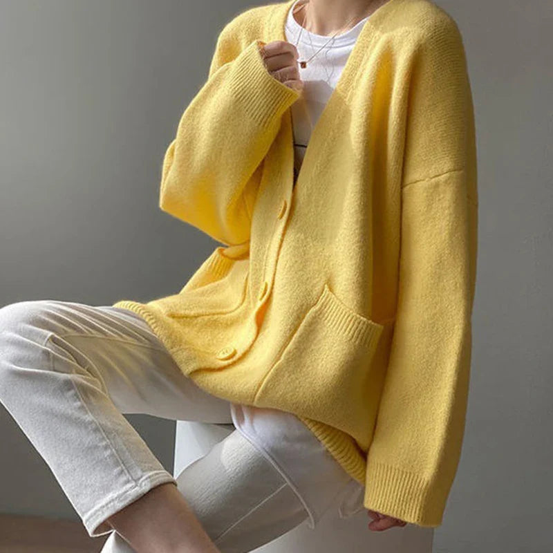 Luxurious long sleeve knitted cardigan in soft yellow hue, ideal for the sophisticated office lady style, showcasing a single-breasted front.
