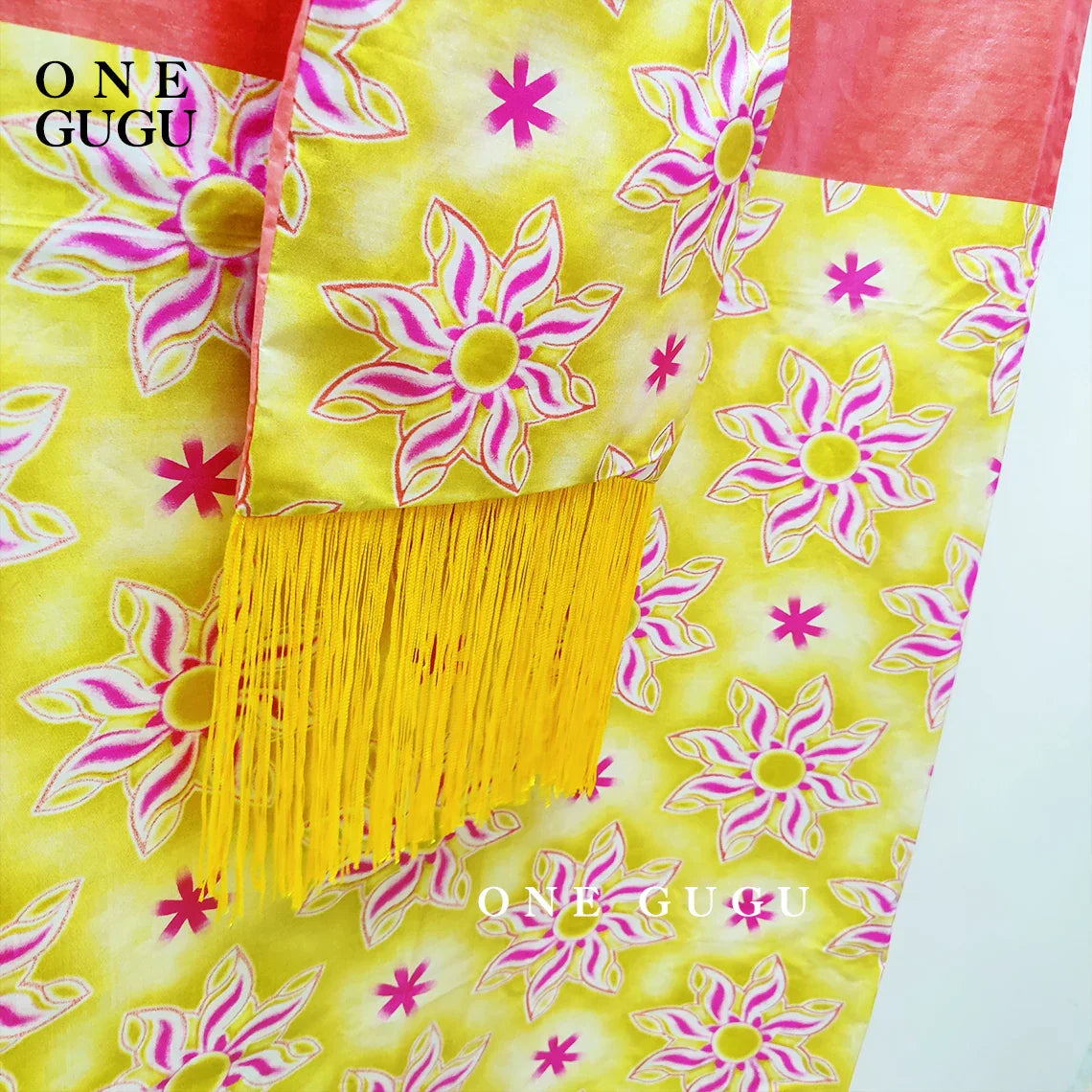 Full-length shot of the Luxury African Dashiki Wedding Dress in Blue Bazin Riche with tassel shawl, showcasing its flowing design and luxurious fabric ideal for weddings.