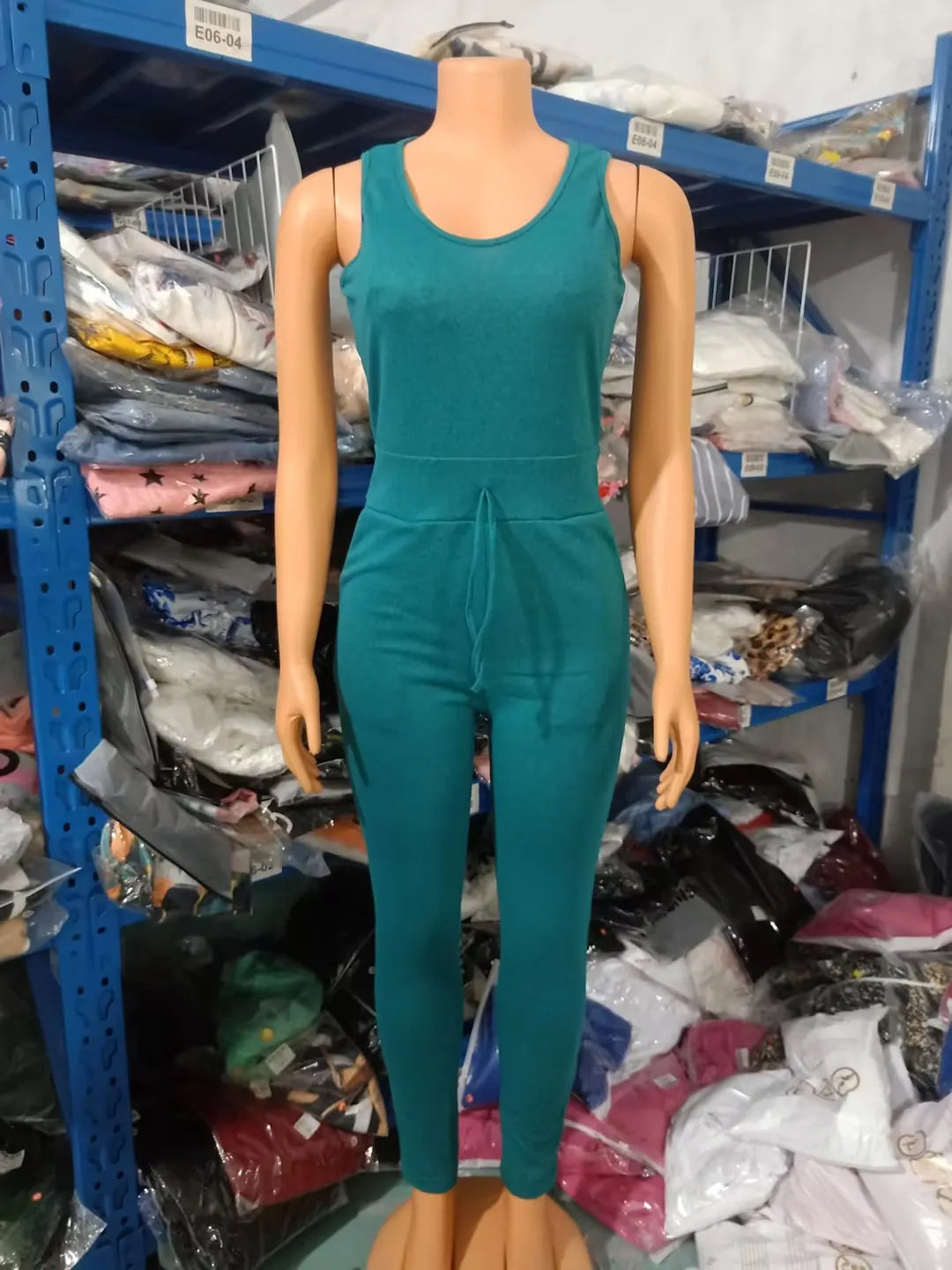 Chic two-piece women's jumpsuit set featuring a sleeveless design paired with a luxurious long sleeve coat, high waist, and stylish drawstring pockets, perfect for sophisticated spring/summer looks.