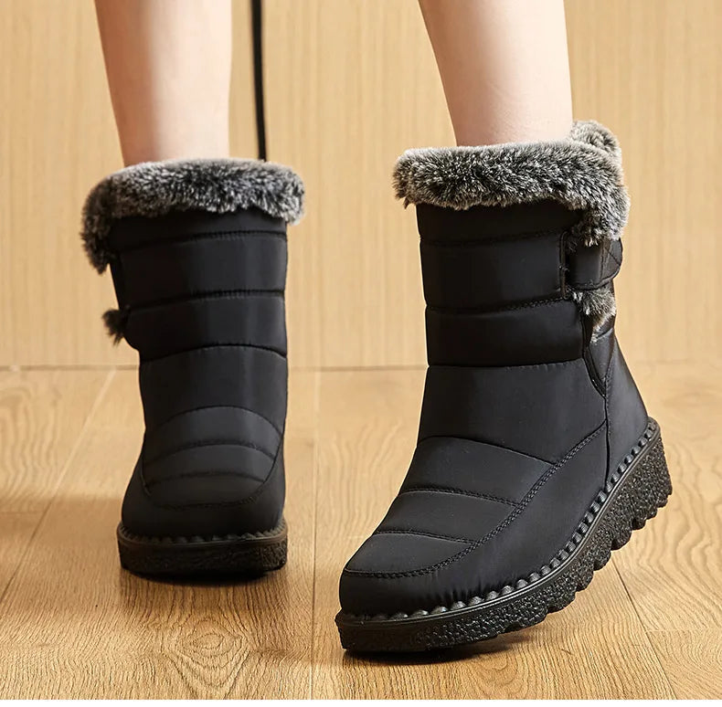 Stylish gourmet women's snow boots with plush lining and solid colour finish, designed for warmth and comfort in cold weather.