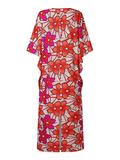 Close-up view of the exquisite fabric and batwing sleeves of the luxury plus size women's bohemian maxi dress, showcasing its flow and elegance.