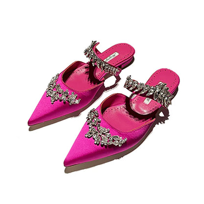 Fashionable women's pointed stiletto mules featuring luxurious silk upper with rhinestone embellishments for a chic summer look.