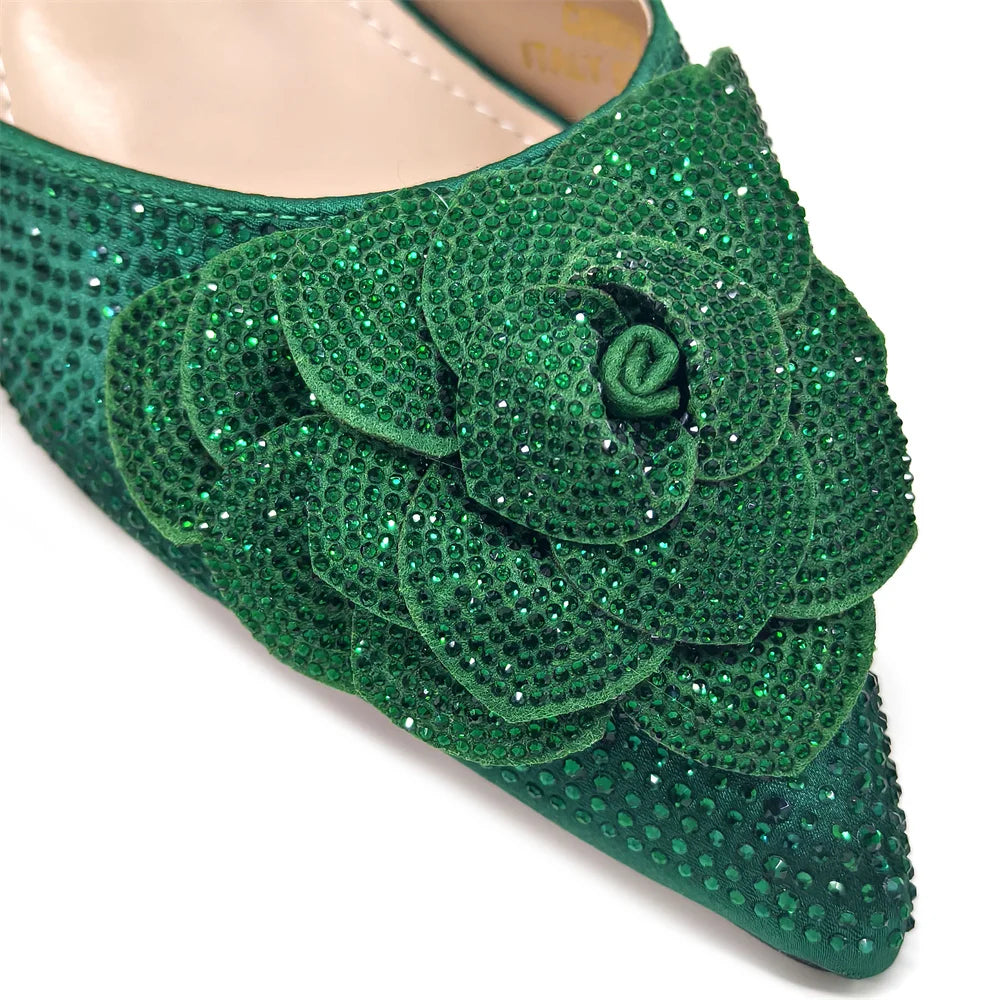 Luxury women's shoe and bag ensemble showcasing sleek pointed-toe pumps and a matching handbag adorned with sparkling rhinestones, designed for formal gatherings.